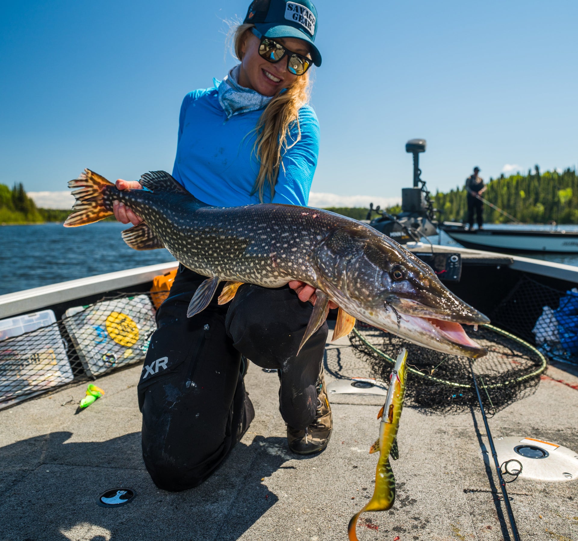 Angler holding fish that was caught using a Fenwick fishing rod