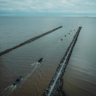 Zoomed out image of boats on water