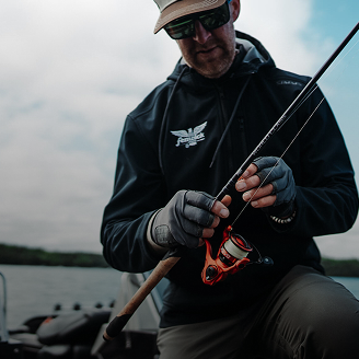 Man Holding Fishing Spinning Rod | Fenwick